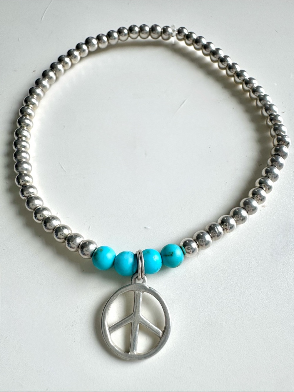 Silver Hematite Stretchy Bracelet w/Sterling Silver Peace Sign Charm